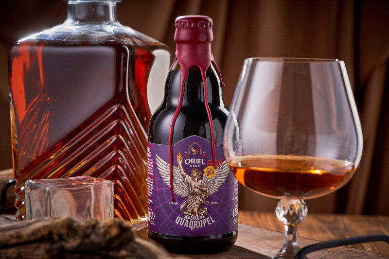 Craft beer pouring into a tulip glass at Oriel Beer microbrewery